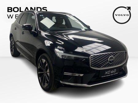 2026 Volvo XC60 Plus model in Onyx Black with the Cardamon interior